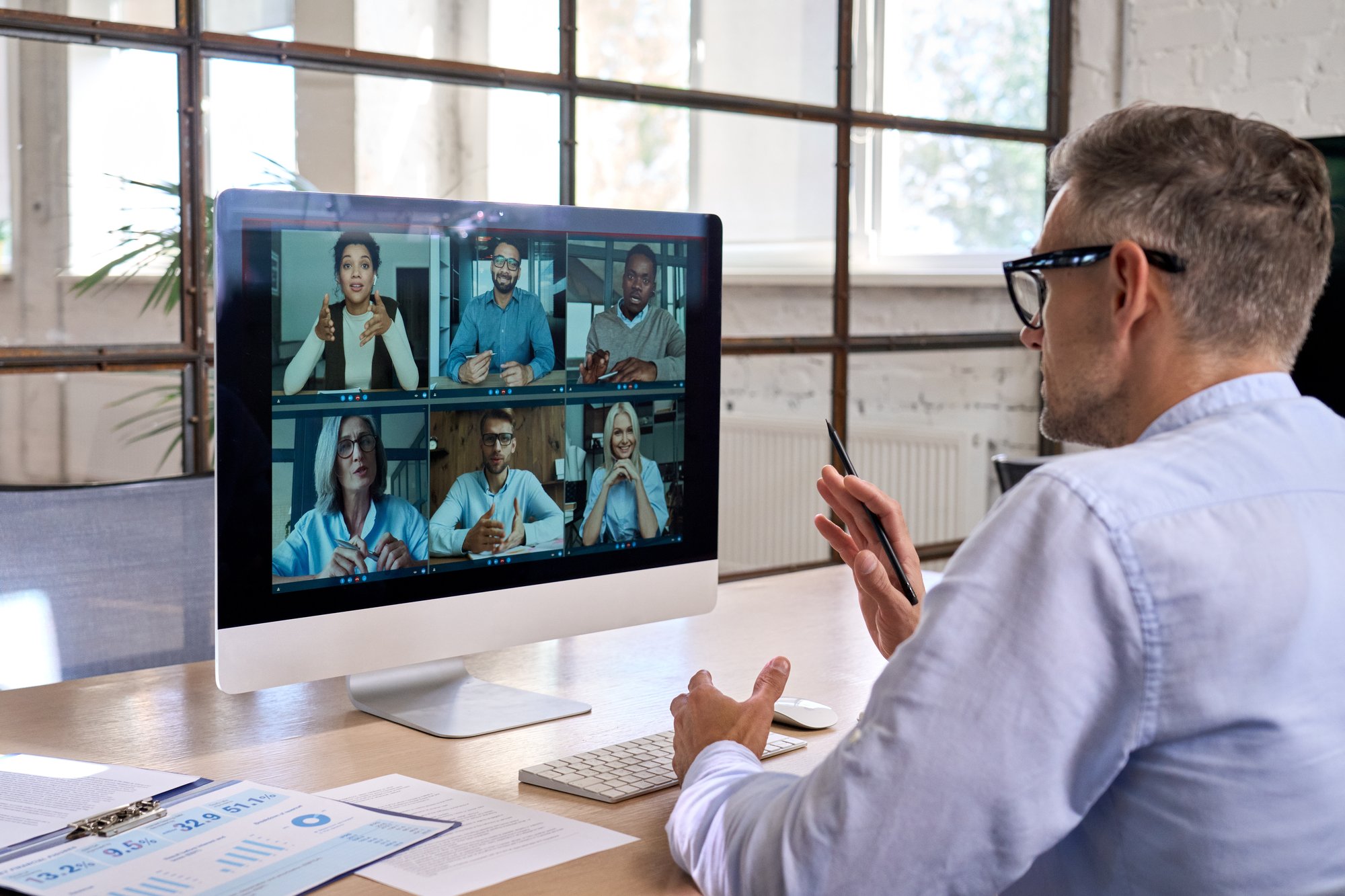 corporate-manager-leading-videoconference-with-tea-2023-11-27-05-27-42-utc