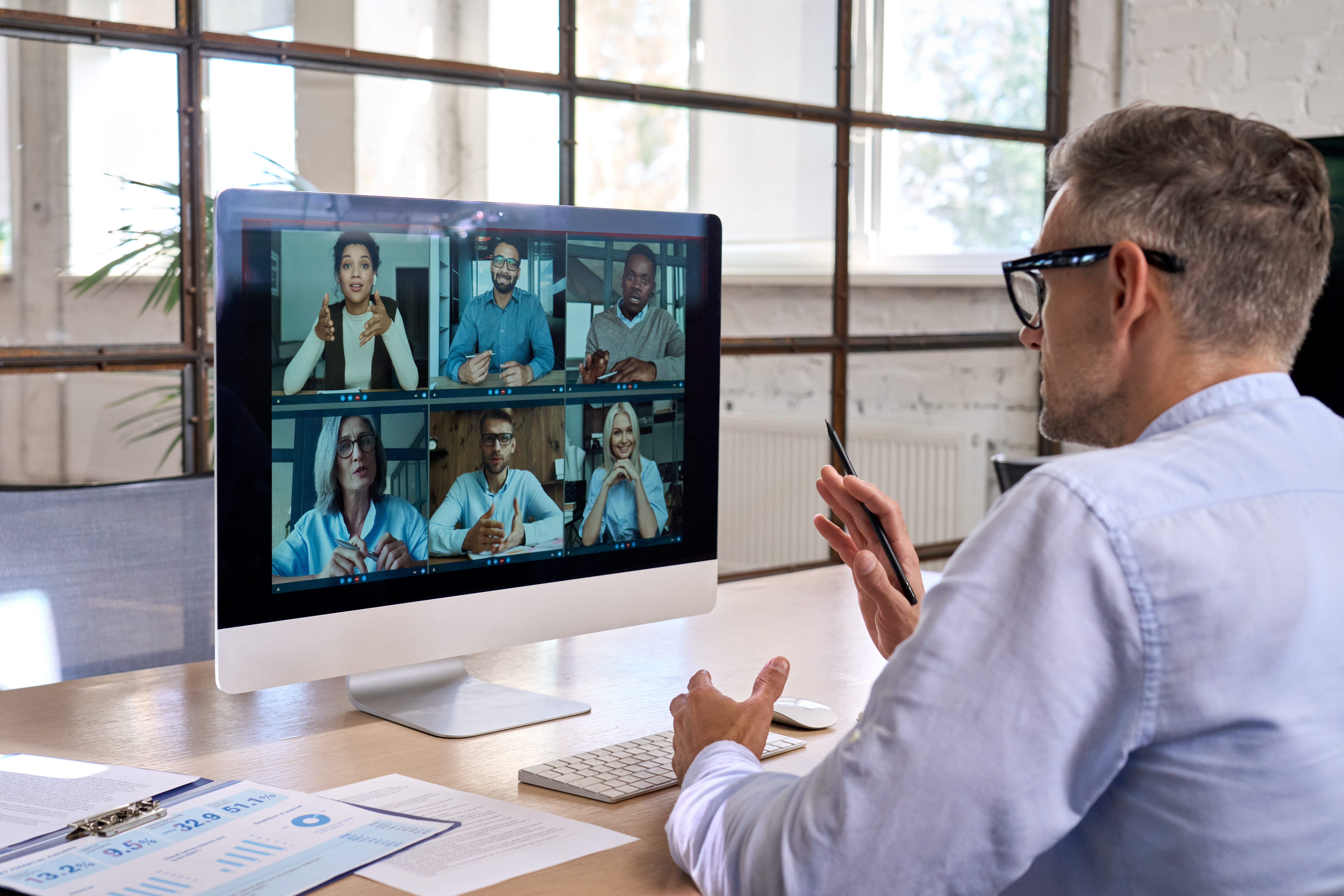 corporate-manager-leading-videoconference-with-tea-2023-11-27-05-27-42-utc